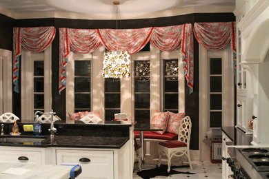 Inspiration for a kitchen remodel in New York with recessed-panel cabinets, white cabinets and an island