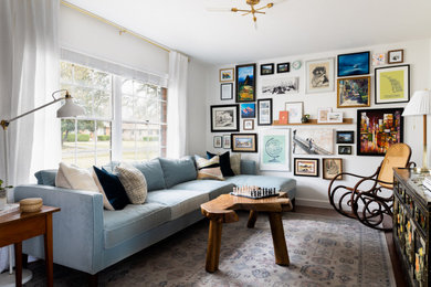 Living room - small eclectic enclosed dark wood floor and brown floor living room idea in Dallas with white walls