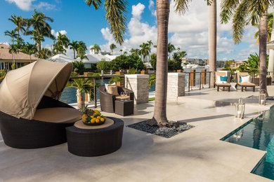 Example of an island style patio design in Miami