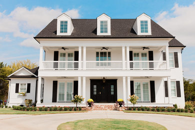Example of a classic white two-story gable roof design in Nashville