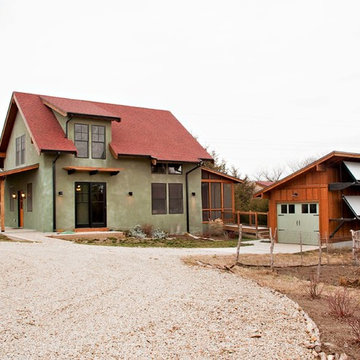 Green Cottage - straw bale house with solar hot water panels on detached garage
