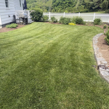 Striped Lawn with White Fence and Stone Edging - Westchester, NY