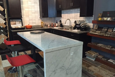 Eat-in kitchen - mid-sized modern eat-in kitchen idea in Baltimore with an undermount sink, marble countertops, white backsplash, stone tile backsplash, an island and dark wood cabinets