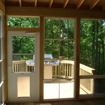 3 Season Room with Eze Breeze windows Leading to Wood Deck for Grilling
