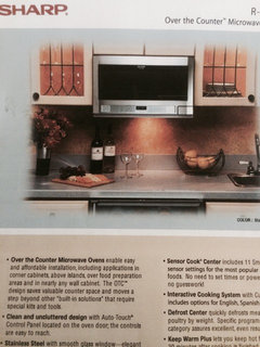 Mounting a microwave via wall attachment