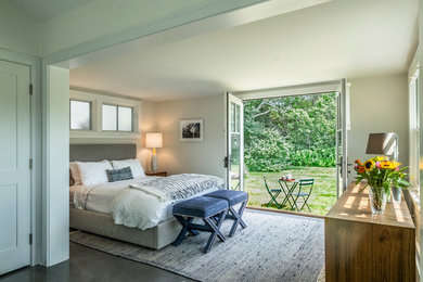 Inspiration for a mid-sized cottage master dark wood floor and brown floor bedroom remodel in Boston with beige walls and no fireplace
