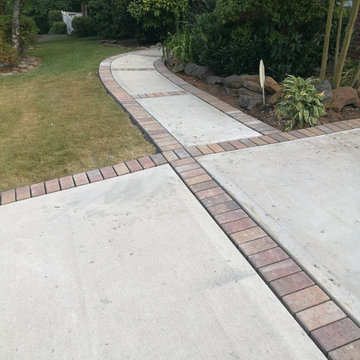 Driveway and sidewalk replacement with custom brick inlay