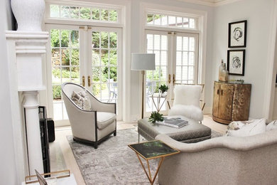 Large transitional enclosed and formal light wood floor living room photo in New York with gray walls and a standard fireplace