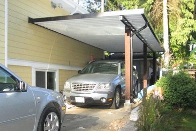 Inspiration for a mid-sized detached two-car carport in Vancouver.