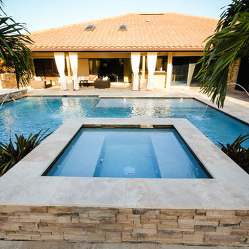 Custom Spa for Roman/Geometric Pool with Water Features Including Sun Shelf in B