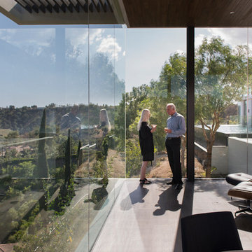 Benedict Canyon Beverly Hills modern luxury home floating glass walled living ro