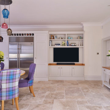 Handcrafted kitchen with round booth seating, TV unit and console table