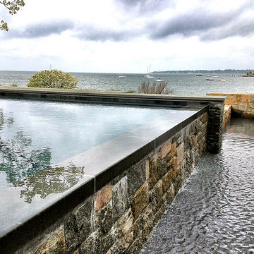 OCEAN: vanishing edge infinity swimming pool + natural stone surround