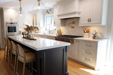 Eat-in kitchen - large transitional l-shaped eat-in kitchen idea in Providence with an undermount sink, quartz countertops and an island