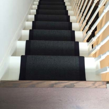 Black Carpet with Black Binding Installed to Stairs