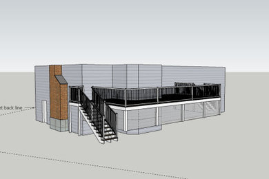 Imagen de terraza planta baja clásica grande sin cubierta en patio trasero con barandilla de varios materiales