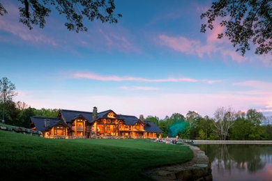Large rustic brown three-story wood gable roof idea in Indianapolis