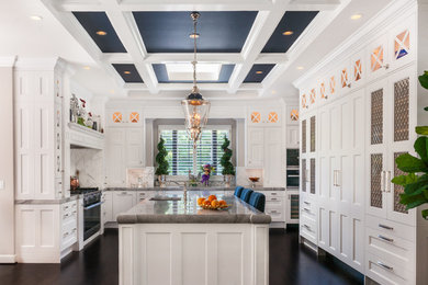 Inspiration for a large traditional u-shaped kitchen pantry in San Francisco with a double-bowl sink, shaker cabinets, white cabinets, granite benchtops, white splashback, stone slab splashback, stainless steel appliances, dark hardwood floors and with island.
