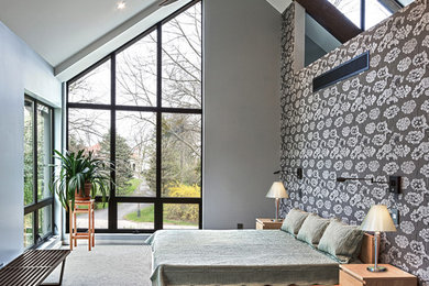Inspiration for a large contemporary master bedroom in Milwaukee with grey walls, carpet, no fireplace and beige floor.