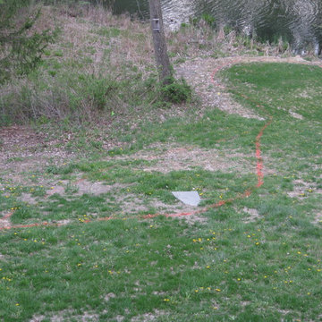 Site before installation - steep, unusable yard