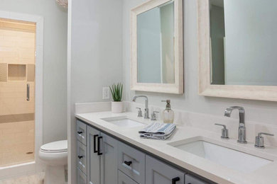 Example of a double-sink bathroom design in Austin with shaker cabinets, gray cabinets, an undermount sink, quartz countertops, white countertops and a built-in vanity