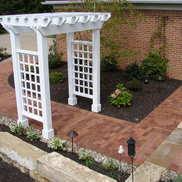Clay paver walk and cedar arbor