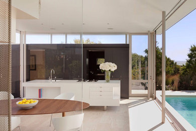 Kitchen/dining room combo - modern kitchen/dining room combo idea in New York