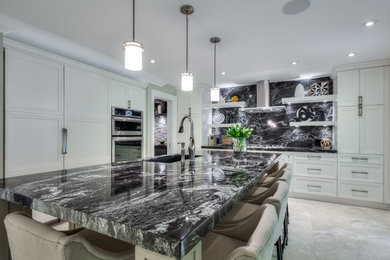 Photo of a mid-sized contemporary l-shaped separate kitchen in Toronto with an undermount sink, shaker cabinets, white cabinets, quartzite benchtops, black splashback, stone slab splashback, panelled appliances, porcelain floors, with island, grey floor and black benchtop.