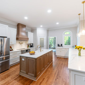 Open Kitchen with Wood Island, Quartz Counters, and Custom Hood