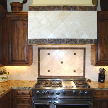 Tuscan Kitchen with Marble Tile Backsplash, Distressed Knotty Alder Cabinets