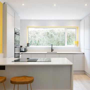 Ebbor Handleless kitchen in light matt grey with maximised storage.