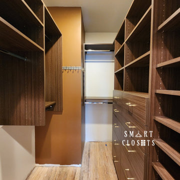Master Walk In Closet in Three Different Finishes Designed by Smart Closets