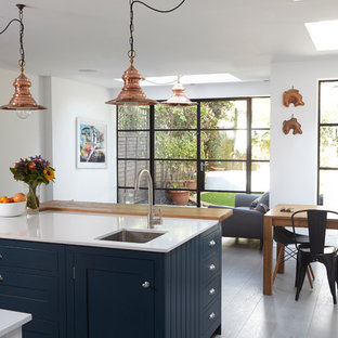 Inspiration for a bohemian kitchen/dining room in London with white walls.