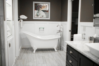Inspiration for a mid-sized contemporary master bathroom in Atlanta with shaker cabinets, black cabinets, a claw-foot tub, an alcove shower, a vessel sink and engineered quartz benchtops.