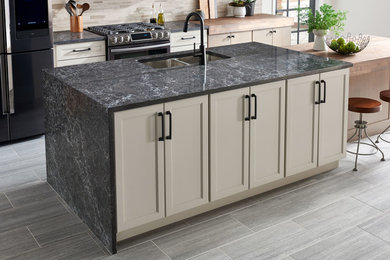 Example of a transitional kitchen design in Atlanta with solid surface countertops