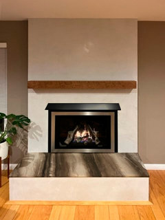 Reducing heat above gas fireplace insert