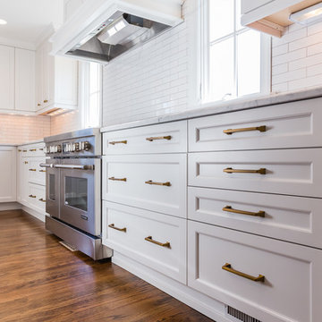 White, gold, and marble kitchen