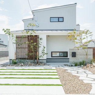 他の地域のアジアンスタイルのおしゃれな家の外観 (戸建、金属屋根) の写真
