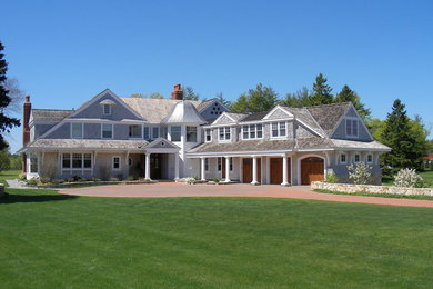 Design ideas for a large traditional two-storey grey exterior in Boston with wood siding.