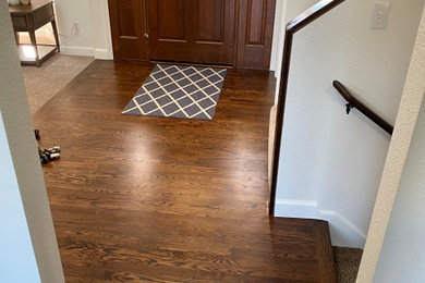 Entryway - contemporary dark wood floor entryway idea in Seattle