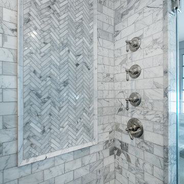 Marble shower mosaic and valves