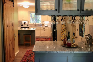 Home bar - mid-sized craftsman single-wall dark wood floor home bar idea in Atlanta with shaker cabinets, granite countertops, gray cabinets and gray backsplash
