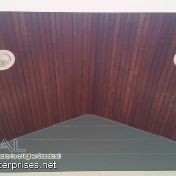 Dark Wood Porch Ceiling with Blue Hardie Plank Siding