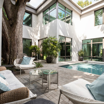 Backyard of House With Pool and Sitting Area