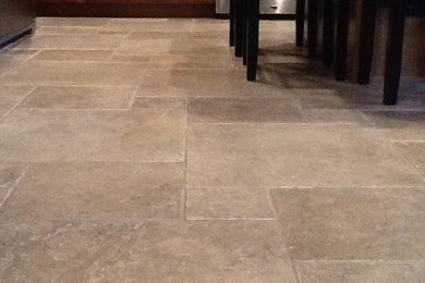 Example of a mid-sized classic travertine floor and beige floor kitchen design in Other
