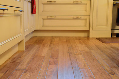 Example of a light wood floor kitchen design in Chicago