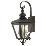 Livex Lighting - Adams 2-Light Bronze Outdoor Medium Wall Lantern, Antique Brass Cluster - The stylish bronze finish outdoor Adams wall lantern is a great way to update your home's exterior decor. A flat metal curved arm attaches the solid brass decorative housing to the square backplate while clear glass shows off the antique brass finish cluster.