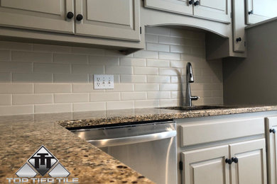 Example of a kitchen design in Kansas City with subway tile backsplash