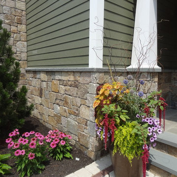 Combining Colonial Tan Natural Stone with Olive Green Siding