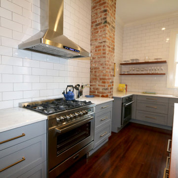 Open shelving and exposed brick are among the many details that encompass the si